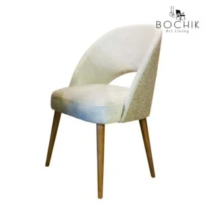 Chaise design en toile et velours avec piétement en bois hêtre massif vernis noyer, idéal pour salle à manger.