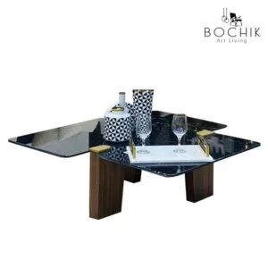 Table basse avec plateau en marbre noir et piètement en bois noyer. Livraison partout au Maroc.