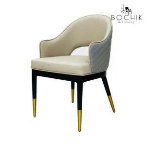 Chaise tendance en toile grise et dossier matelassé avec piètement en bois et Acier Inoxydable Couleur Or.